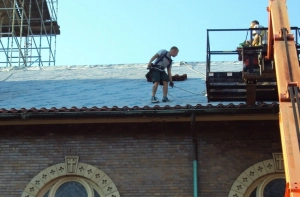 HKC Roofing & Construction workers replacing a commercial roof on a church in Louisville, KY